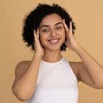 Pretty Woman in White Tank Top Smiling